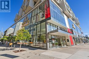Toronto (Mount Pleasant West) condo for rent - A modern building with a glass facade and a sign that reads "Fairway".