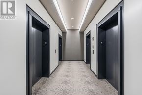 Toronto (Mount Pleasant West) condo for rent - A hallway with elevators on both sides and a carpeted floor.