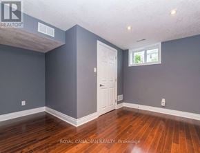 Oshawa (Lakeview) apartment for rent - A room with a white door and a window with a white frame.