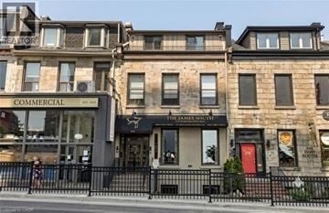Hamilton apartment for rent - A building with a sign that says "Commercial" is visible.