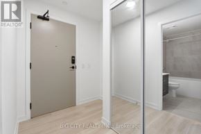 Mississauga (Hurontario) condo for rent - A room with a white door and a mirror on the wall.