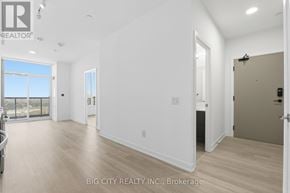 Mississauga (Hurontario) condo for rent - A spacious room with a view of the city through the window.