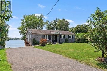 Champlain apartment for rent - A house with a gravel driveway in front of it.