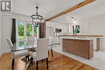 Champlain apartment for rent - A modern kitchen with a dining table set up.