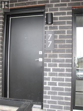 Niagara Falls (Morrison) townhouse for rent - A black door with a number 7 on it.