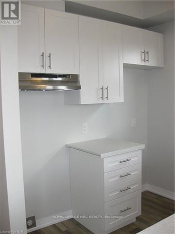Niagara Falls (Morrison) townhouse for rent - A white kitchen with a cabinet and drawers.