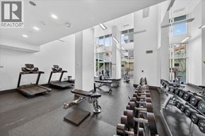 Vancouver apartment for rent - A gym with treadmills, rowing machines, and dumbbells.