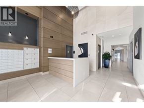Vancouver apartment for rent - A reception area with a white counter and a wooden cabinet.