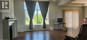 Welland apartment for rent - A living room with a fireplace and a television.