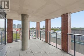 Toronto (Thorncliffe Park) condo for rent - A balcony with a glass railing and a concrete pillar.