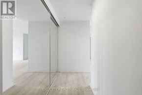 Toronto (Thorncliffe Park) condo for rent - A room with white walls and a wooden floor.