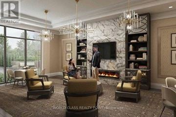 Vaughan (Beverley Glen) condo for rent - A living room with a fireplace and a television on the wall.