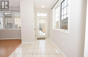 Clarington (Bowmanville) apartment for rent - A hallway with a door leading to a balcony.