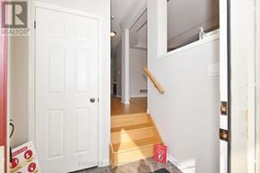 Clarington (Bowmanville) apartment for rent - A white door with a glass window is open.