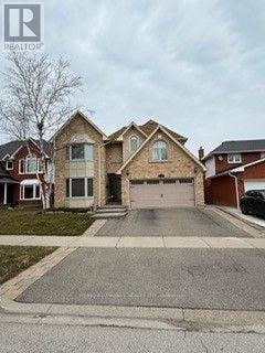 Burlington (Headon) apartment for rent - A large house with a driveway in front.