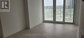Mississauga (City Centre) condo for rent - A room with a view of the city through large windows.