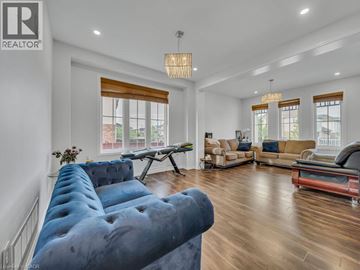 Cambridge apartment for rent - A living room with a blue couch and a wooden floor.