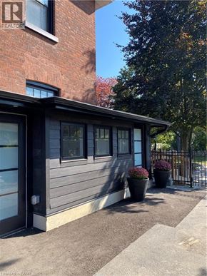 Brantford apartment for rent - A building with a sign that says REALTOR on it.