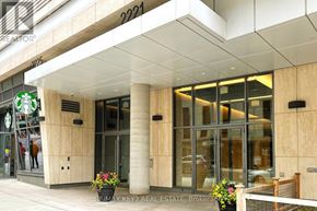 Toronto (Mount Pleasant West) condo for rent - The entrance to a building with a Starbucks on the left.