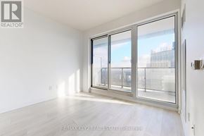 Toronto (Mount Pleasant West) condo for rent - A room with a large window and a sliding glass door.