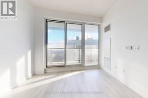 Toronto (Mount Pleasant West) condo for rent - A room with a large window and a sliding glass door.