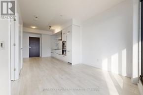 Toronto (Mount Pleasant West) condo for rent - A spacious, empty room with white walls and a wooden floor.