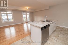 Barrie (Innis-Shore) apartment for rent - A kitchen with a sink and a dishwasher.