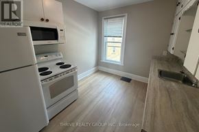 London East (East F) apartment for rent - A kitchen with white appliances and a window.