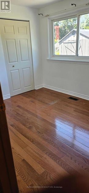 Toronto (Wexford-Maryvale) apartment for rent - A room with a white door and a window with a view of a red building outside.