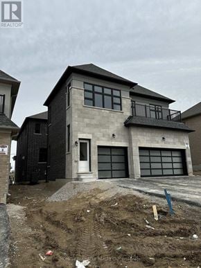 Bradford West Gwillimbury (Bond Head) apartment for rent - A house under construction with a grey exterior and a balcony on the second floor.
