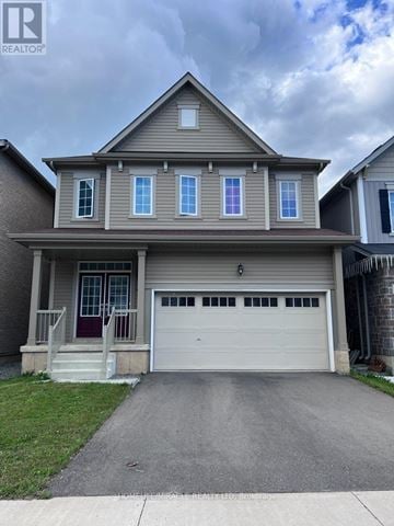 Niagara Falls (Brown) apartment for rent - A house with a brown roof and a red door is for sale.