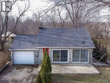 Hamilton (Stoney Creek) apartment for rent - A house with a red door and a garage door.