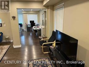 Milton (De Dempsey) apartment for rent - A living room with a couch, chair, and television.