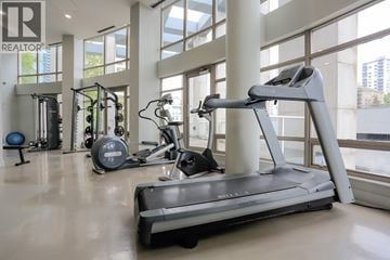 Vancouver apartment for rent - A treadmill is in the middle of a spacious room with other exercise equipment.
