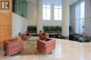 Vancouver apartment for rent - A lobby area with a glass wall and a sign that says REALTOR.