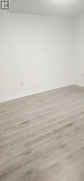 Mississauga (East Credit) apartment for rent - A room with a wooden floor and white walls.