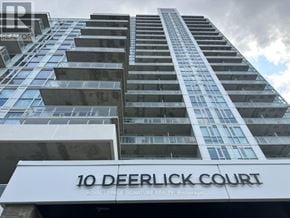 Toronto (Parkwoods-Donalda) condo for rent - A tall building with the name 10 Deerlick Court on the front.