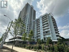 Toronto (Parkwoods-Donalda) condo for rent - A modern building with glass windows and balconies is under construction.