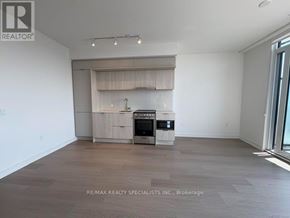 Mississauga (City Centre) condo for rent - A spacious living room with a built-in kitchenette.