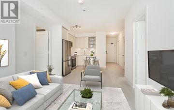 Mississauga (Central Erin Mills) house for rent - A modern living room with a grey sofa and a glass coffee table.