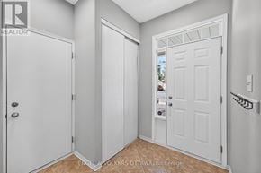 Ottawa apartment for rent - A white door is open to a hallway.