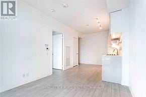 Vaughan (Vaughan Corporate Centre) condo for rent - A white room with a wooden floor and a white cabinet with a sink.