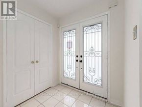 Brampton (Fletcher's Meadow) apartment for rent - A white door with a glass window and a white wall.
