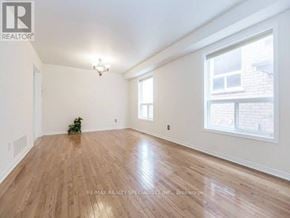 Brampton (Fletcher's Meadow) apartment for rent - A room with wooden flooring and a window on the right side.