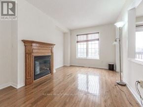 Brampton (Fletcher's Meadow) apartment for rent - A room with a fireplace and wooden floors.