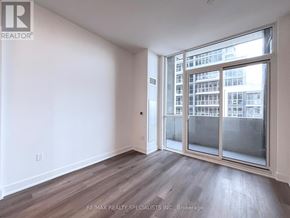 Milton (Tm Timberlea) condo for rent - A room with a large window and wooden flooring.