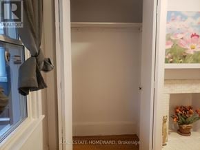 Toronto (Dovercourt-Wallace Emerson-Junction) apartment for rent - A room with a white door and a window with a curtain.