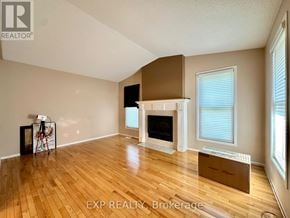 Ottawa apartment for rent - A room with a fireplace and wooden floors.