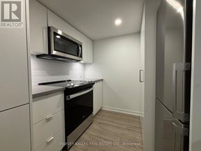 Toronto (Clanton Park) condo for rent - A modern kitchen with a microwave above the stove.