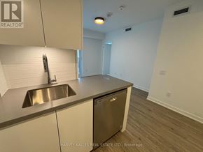 Toronto (Clanton Park) condo for rent - A kitchen with a sink and a dishwasher.